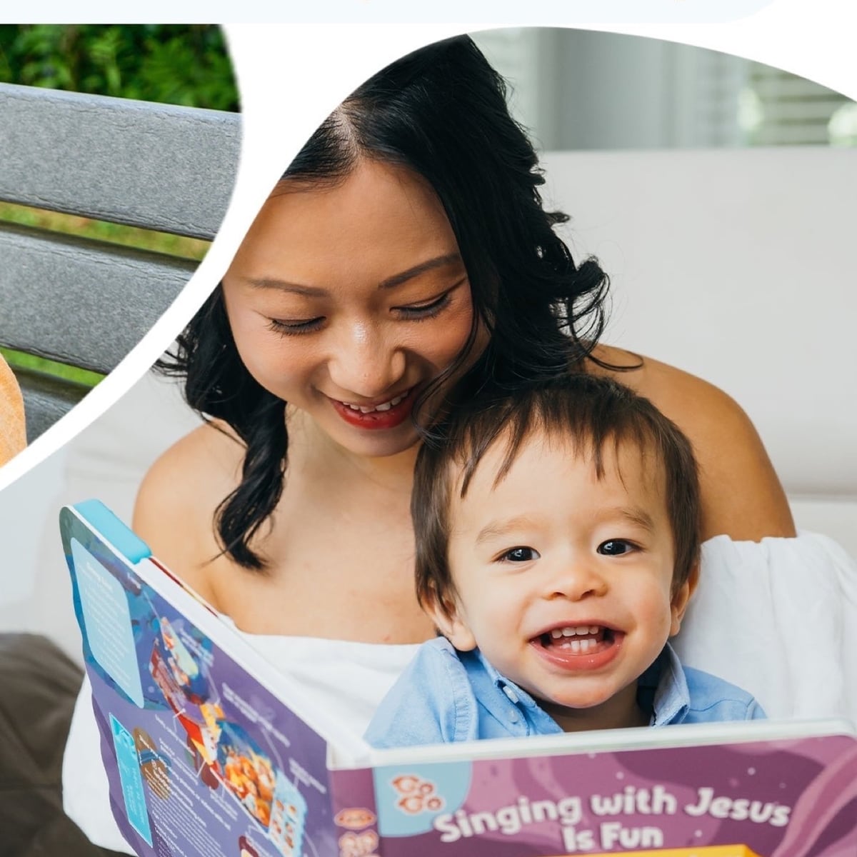 A parent and young child reading the Go Go Fun Learning Singing with Jesus Is Fun sound book together