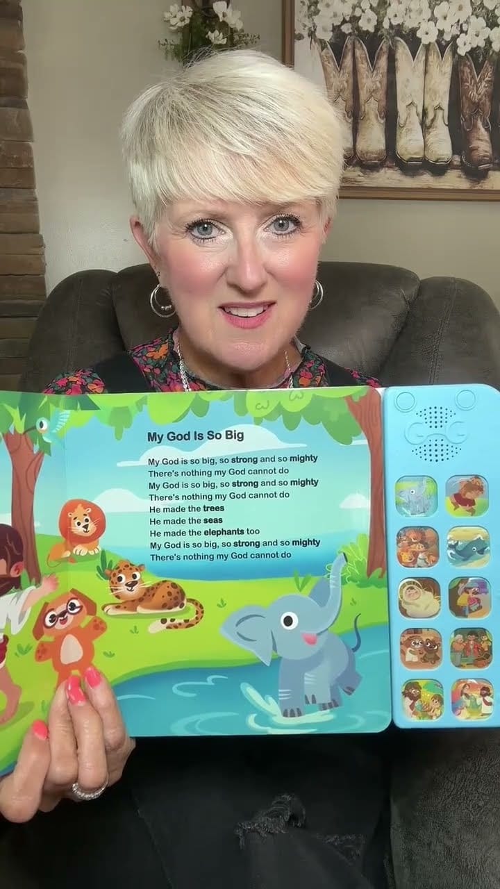A parent reading aloud the 'My God Is So Big' song from a Go Go Fun Learning Christian sound book